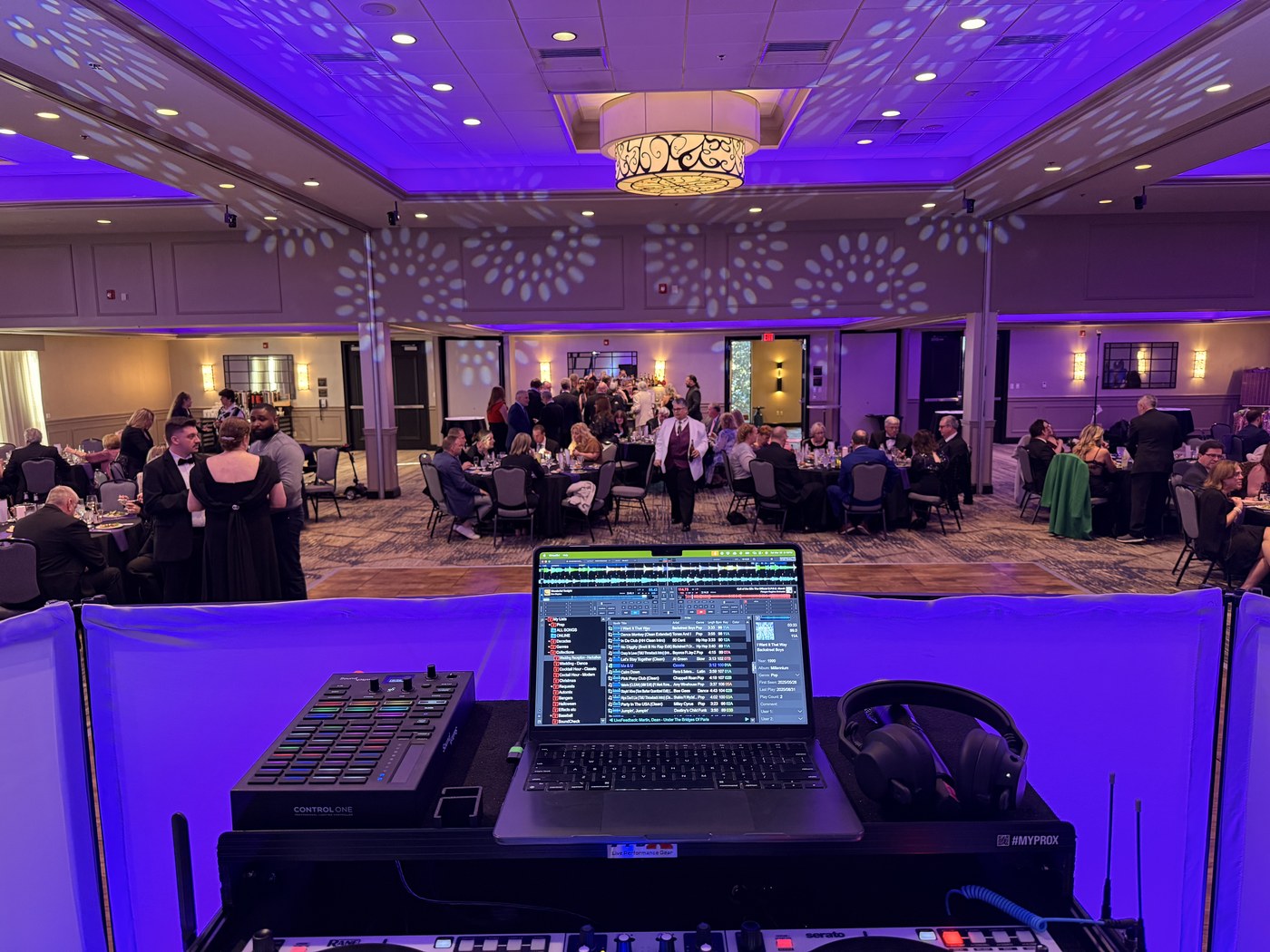 James working from the DJ booth as guests dance