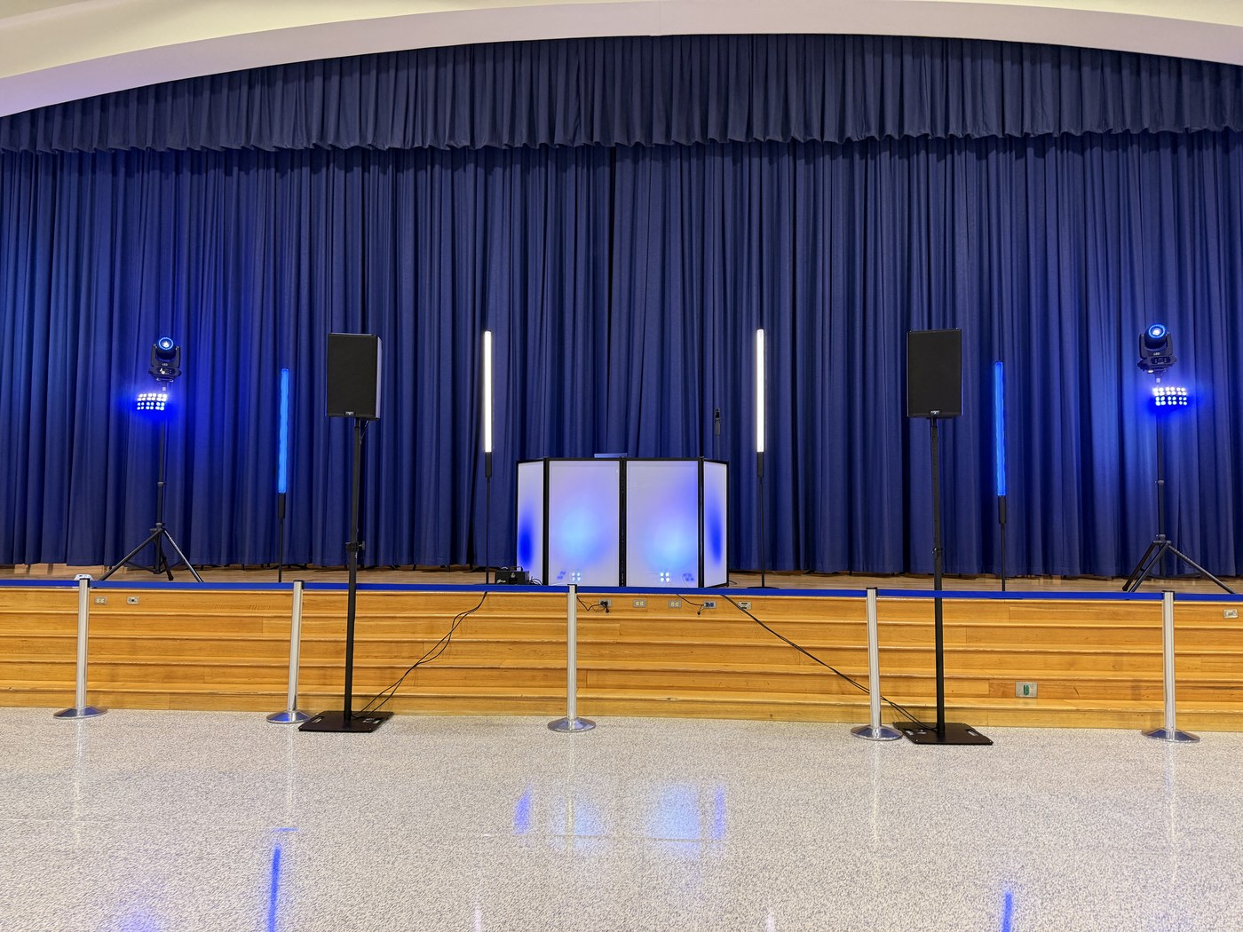 A professional school-event DJ and lighting setup